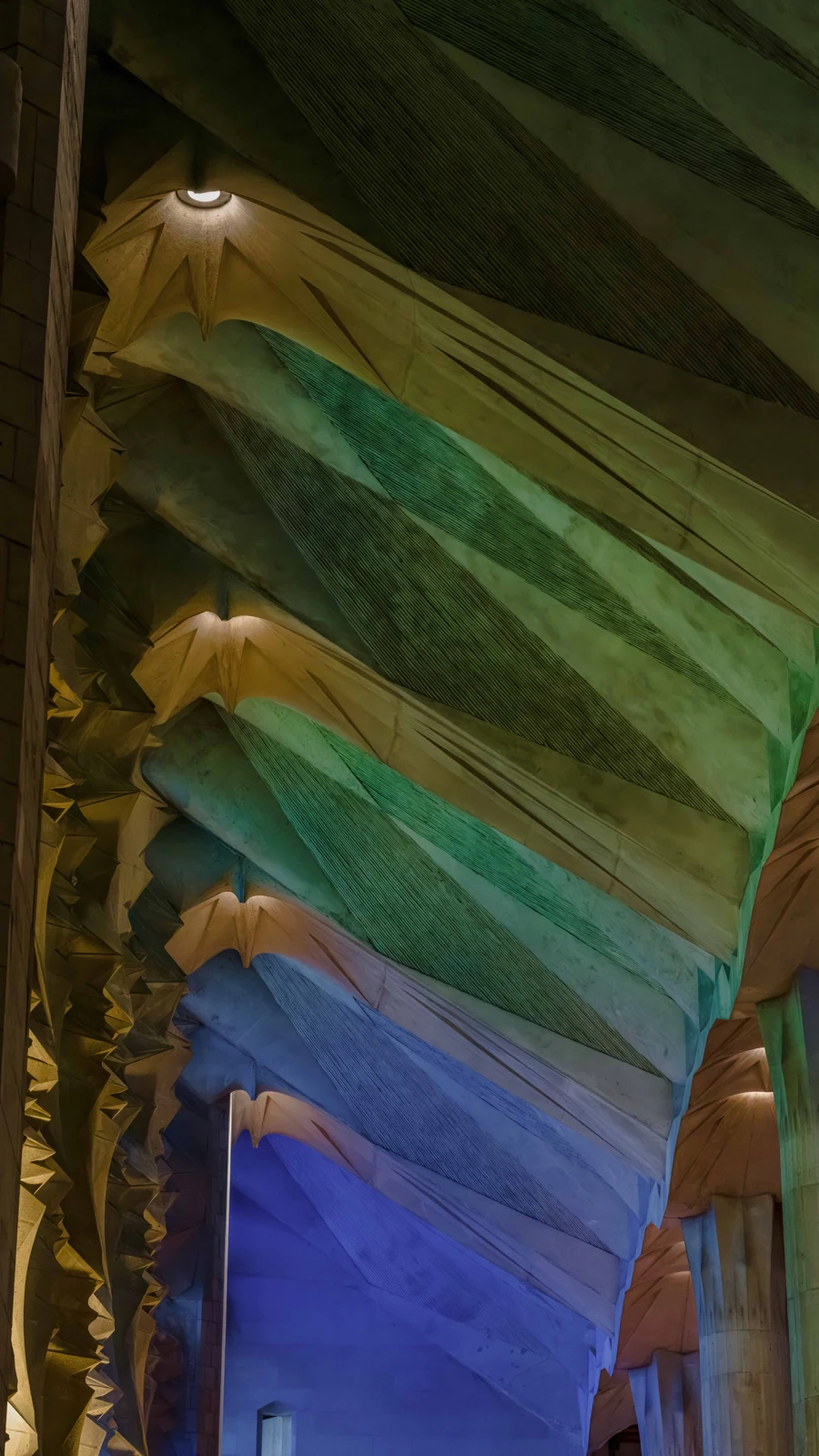 Light in Formation — colored light across the stone interior of La Sagrada Família